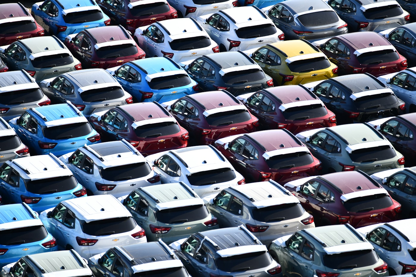 Rows of new vehicles in a dealership lot